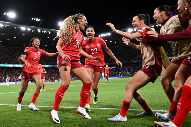 Switzerland's forward #20 Alayah Pilgrim celebrates with teammates after scoring the second goal of the match during the UEFA Women's Euro 2025 Group A football match between Switzerland and Iceland at the Wankdorf stadium in Bern, on July 6, 2025. (Photo by SEBASTIEN BOZON / AFP)