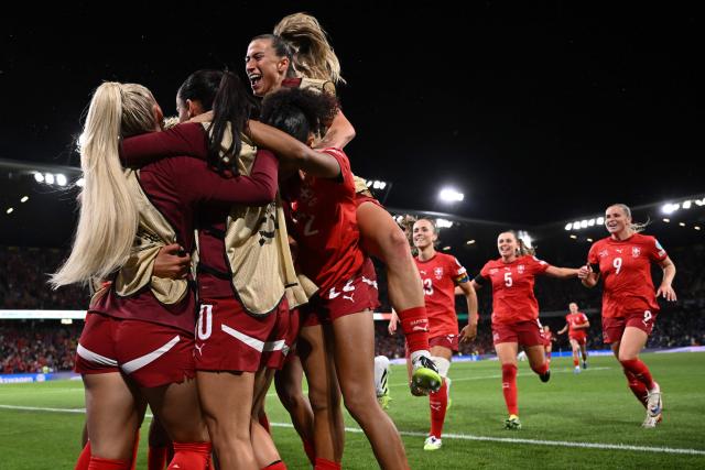 Switzerland players celebrate the team's second goal of the match during the UEFA Women's Euro 2025 Group A football match between Switzerland and Iceland at the Wankdorf stadium in Bern, on July 6, 2025. (Photo by SEBASTIEN BOZON / AFP)