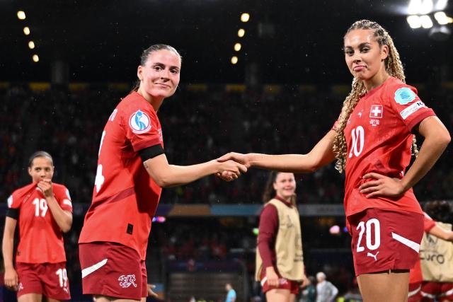 Switzerland's midfielder #14 Smilla Vallotto and Switzerland's forward #20 Alayah Pilgrim celebrate after beating Iceland 2-0 at the end of the UEFA Women's Euro 2025 Group A football match between Switzerland and Iceland at the Wankdorf stadium in Bern, on July 6, 2025. (Photo by SEBASTIEN BOZON / AFP)