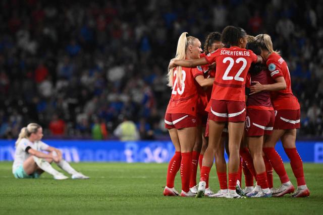 Switzerland players celebrate their team's 2-0 win over Iceland at the end of the UEFA Women's Euro 2025 Group A football match between Switzerland and Iceland at the Wankdorf stadium in Bern, on July 6, 2025. (Photo by SEBASTIEN BOZON / AFP)
