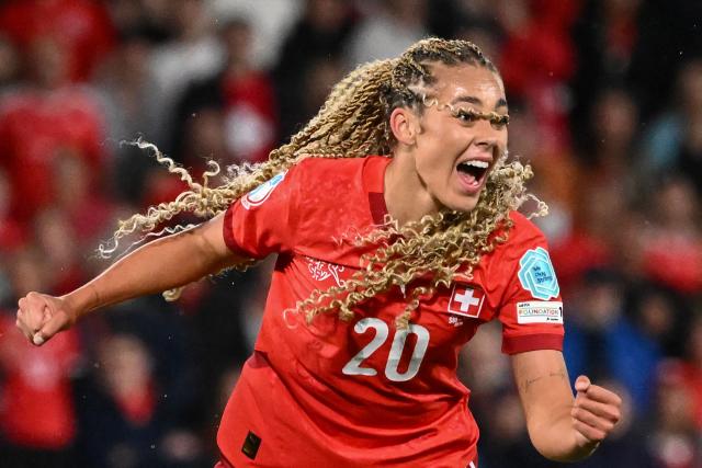 TOPSHOT - Switzerland's forward #20 Alayah Pilgrim celebrates after scoring the second goal of the match during the UEFA Women's Euro 2025 Group A football match between Switzerland and Iceland at the Wankdorf stadium in Bern, on July 6, 2025. (Photo by SEBASTIEN BOZON / AFP)