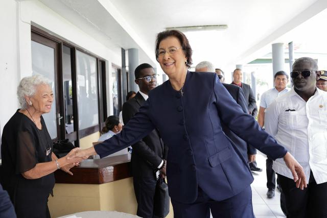 Suriname's opposition leader Jennifer Geerlings-Simons greets a woman after the National Assembly election in Paramaribo on July 6, 2025. Lawmakers elected Jennifer Geerlings-Simons as Suriname's first woman president on July 6, 2025, after her party won the most seats in legislative elections in May. (Photo by Ranu Abhelakh / AFP)