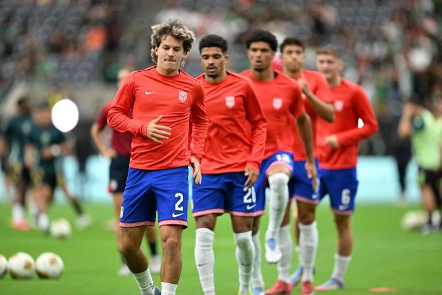 United States' defender #02 John Tolkin warms up ahead of the Concacaf Gold Cup final football match between Mexico and USA at NRG Stadium in Houston, Texas on July 6, 2025. (Photo by CHANDAN KHANNA / AFP)