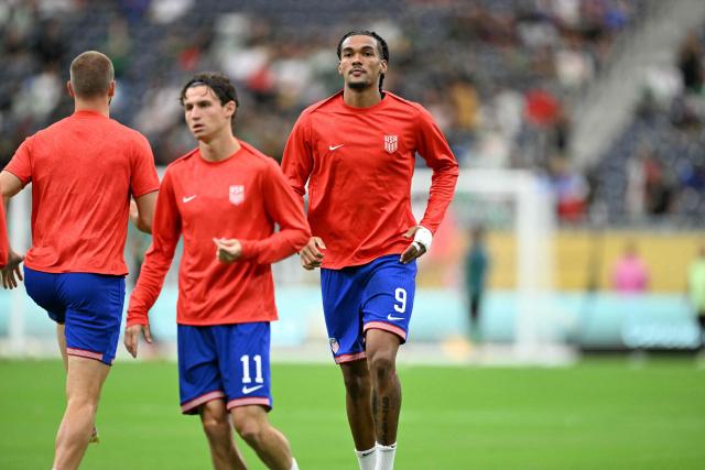 United States' midfielder #11 Brenden Aaronson and United States' forward #09 Damion Downs warm up ahead of the Concacaf Gold Cup final football match between Mexico and USA at NRG Stadium in Houston, Texas on July 6, 2025. (Photo by CHANDAN KHANNA / AFP)
