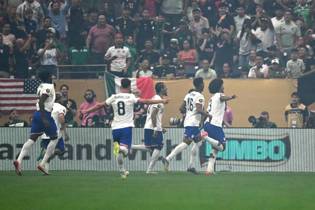 United States' defender #03 Chris Richards (R) celebrates scoring his team's first goal during the Concacaf Gold Cup final football match between Mexico and USA at NRG Stadium in Houston, Texas on July 6, 2025. (Photo by CHANDAN KHANNA / AFP)
