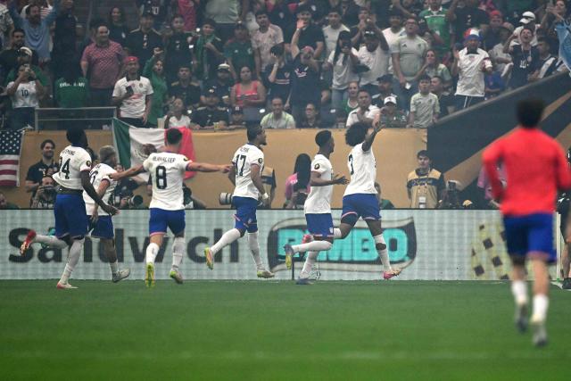United States' defender #03 Chris Richards (R) celebrates scoring his team's first goal during the Concacaf Gold Cup final football match between Mexico and USA at NRG Stadium in Houston, Texas on July 6, 2025. (Photo by CHANDAN KHANNA / AFP)
