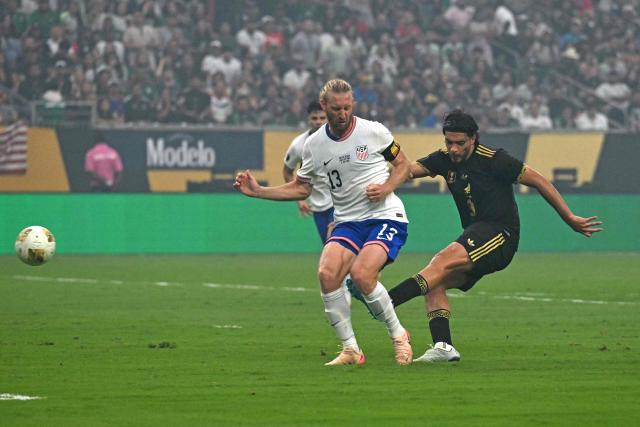 Mexico's forward #09 Raul Jimenez scores his team's first goal during the Concacaf Gold Cup final football match between Mexico and USA at NRG Stadium in Houston, Texas on July 6, 2025. (Photo by Chandan Khanna / AFP)