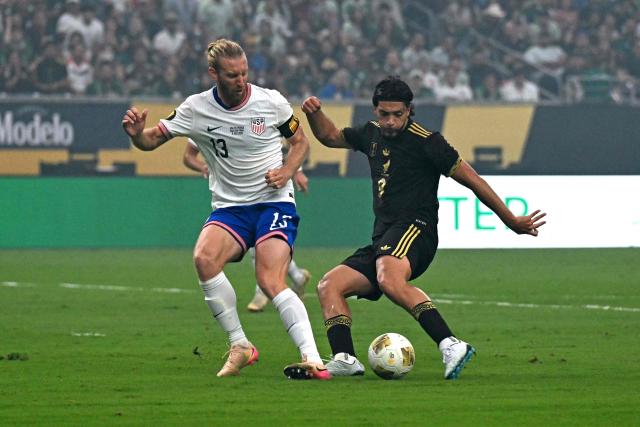 Mexico's forward #09 Raul Jimenez scores his team's first goal during the Concacaf Gold Cup final football match between Mexico and USA at NRG Stadium in Houston, Texas on July 6, 2025. (Photo by Chandan Khanna / AFP)