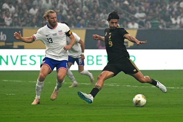 Mexico's forward #09 Raul Jimenez scores his team's first goal during the Concacaf Gold Cup final football match between Mexico and USA at NRG Stadium in Houston, Texas on July 6, 2025. (Photo by Chandan Khanna / AFP)