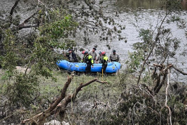 Members of a rescue team look for missing people on the Guadalupe River in Kerrville, Texas, on July 6, 2025, following severe flash flooding that occured during the July 4 holiday weekend. Rescuers in Texas raced against time Sunday to find dozens of missing people, including children, swept away by flash floods that killed at least 78, as forecasters warned of new deluges. Local Texans joined forces with disaster officials to search through the night for the missing, including 27 girls from a riverside Christian summer camp. Texas Governor Greg Abbott said Camp Mystic on the banks of the Guadalupe River, where some 750 girls had been staying when the floodwaters hit, had been "horrendously ravaged in ways unlike I've seen in any natural disaster." (Photo by RONALDO SCHEMIDT / AFP)