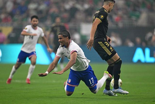 United States' midfielder #17 Malik Tillman fights for the ball with Mexico's defender #03 Cesar Montes during the Concacaf Gold Cup final football match between Mexico and USA at NRG Stadium in Houston, Texas on July 6, 2025. (Photo by CHANDAN KHANNA / AFP)