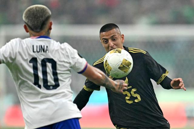 United States' midfielder #10 Diego Luna fights for the ball with Mexico's midfielder #25 Roberto Alvarado during the Concacaf Gold Cup final football match between Mexico and USA at NRG Stadium in Houston, Texas on July 6, 2025. (Photo by CHANDAN KHANNA / AFP)