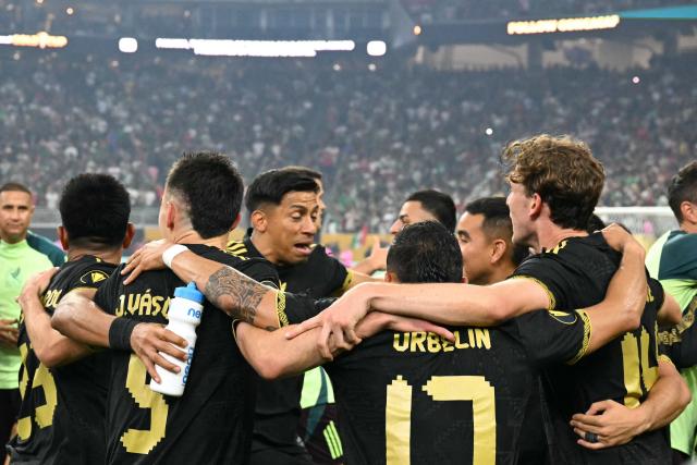Mexico's players celebrate their team's victory at the end of the Concacaf Gold Cup final football match between Mexico and USA at NRG Stadium in Houston, Texas on July 6, 2025. (Photo by Chandan Khanna / AFP)
