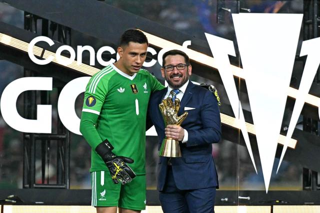Mexico's goalkeeper #01 Luis Malagon (L) poses with the Best Goalkeeper trophy at the end of the Concacaf Gold Cup final football match between Mexico and USA at NRG Stadium in Houston, Texas on July 6, 2025. (Photo by Chandan Khanna / AFP)