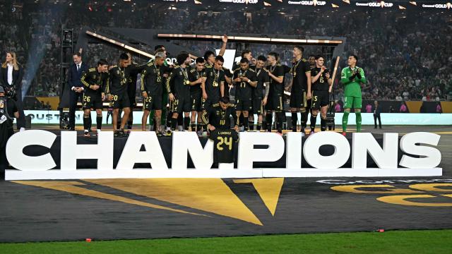 Mexico's forward #10 Alexis Vega holds Mexico's midfielder #24 Luis Chavez jersey's as they celebrate their victory at the end of the Concacaf Gold Cup final football match between Mexico and USA at NRG Stadium in Houston, Texas on July 6, 2025. (Photo by Chandan Khanna / AFP)