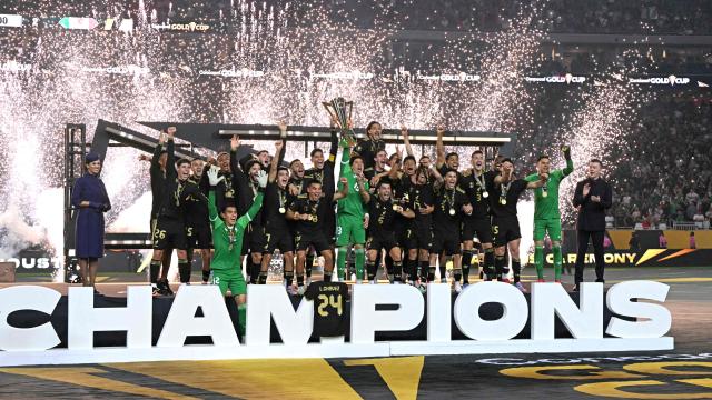Mexico's players celebrate with the trophy their victory at the end of the Concacaf Gold Cup final football match between Mexico and USA at NRG Stadium in Houston, Texas on July 6, 2025. (Photo by Chandan Khanna / AFP)