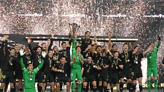 Mexico's players celebrate with the trophy their victory at the end of the Concacaf Gold Cup final football match between Mexico and USA at NRG Stadium in Houston, Texas on July 6, 2025. (Photo by Chandan Khanna / AFP)