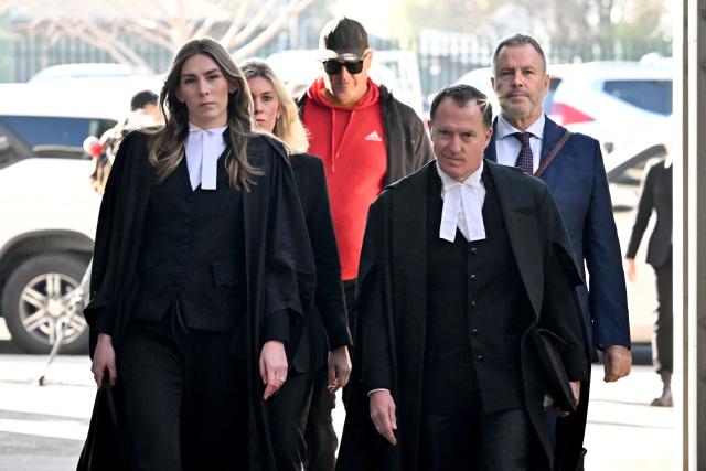 Lead barrister Colin Mandy (2nd R) arrives with (L-R) Barrister Sophie Stafford, Lawyer Ophelia Holloway and Lawyer Bill Doogue at the Latrobe Valley Magistrates' Court in Morwell on July 7, 2025. Jury members will deliver a verdict on July 7 in the trial of an Australian woman accused of killing three lunch guests with toxic mushrooms, court officials said. Erin Patterson, who has steadfastly maintained her innocence, has been charged with three counts of murder and one of attempted murder. (Photo by WILLIAM WEST / AFP)