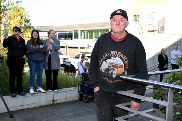 Local residents stand outside the Latrobe Valley Magistrates' Court in Morwell on July 7, 2025. An Australian woman murdered her husband's parents and aunt by lacing their beef Wellington lunch with toxic mushrooms, a jury found on July 7 at the climax of a trial watched around the world. Keen home cook Erin Patterson hosted an intimate meal in July 2023 that started with good-natured banter and earnest prayer -- but ended with three guests dead. (Photo by WILLIAM WEST / AFP)