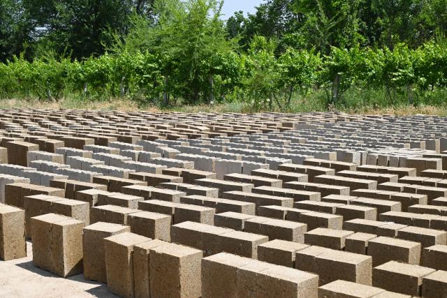 A view of the production facility of rice construction blocks, made mostly of rice husks - a byproduct of rice processing, in the Batken region in southern Kyrgyzstan on May 22, 2025. (Photo by Guliza Urustambek kyzy / AFP)