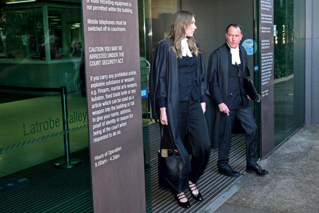 Lead barrister Colin Mandy (R) leaves the Latrobe Valley Magistrates' Court with Barrister Sophie Stafford in Morwell on July 7, 2025. An Australian woman murdered her husband's parents and aunt by lacing their beef Wellington lunch with toxic mushrooms, a jury found on July 7 at the climax of a trial watched around the world. Keen home cook Erin Patterson hosted an intimate meal in July 2023 that started with good-natured banter and earnest prayer -- but ended with three guests dead. (Photo by WILLIAM WEST / AFP)