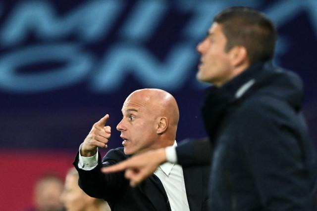 Italy's Italian head coach Andrea Soncin (L) gestures from the techincal area in front of Portugal's head coach Francisco Neto (R) during the UEFA Women's Euro 2025 Group B football match between Portugal and Italy at the Stade de Geneve in Geneva, on July 7, 2025. (Photo by Fabrice COFFRINI / AFP)