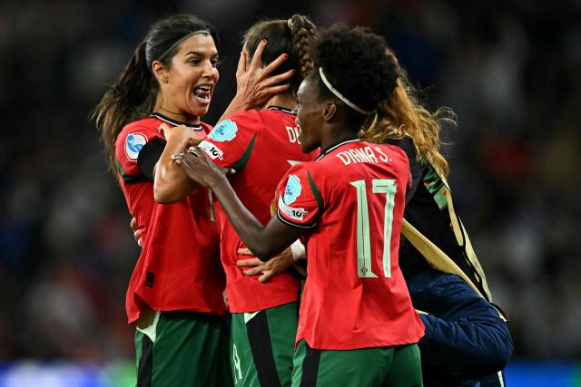 Portugal's defender #19 Diana Gomes (C) celebrates with Portugal's defender #15 Carole Costa (L) after scoring Portugal's first goal during the UEFA Women's Euro 2025 Group B football match between Portugal and Italy at the Stade de Geneve in Geneva, on July 7, 2025. (Photo by Fabrice COFFRINI / AFP)
