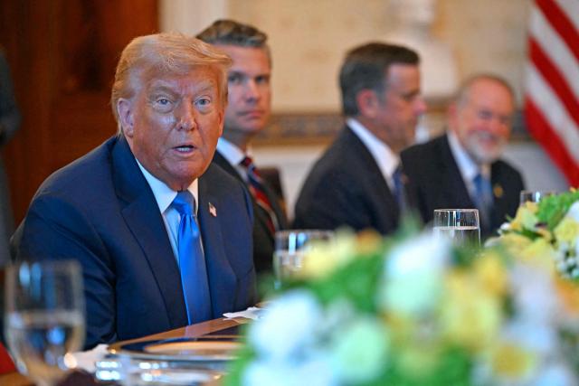 US President Donald Trump meets with unseen Israeli Prime Minister Benjamin Netanyahu at the Blue Room of the White House in Washington, DC, on July 7, 2025. Prime Minister Netanyahu will meet Monday with President Trump, who expressed hope for a "deal this week" between Israel and Hamas that sees hostages released from the Gaza Strip. Indirect negotiations between Israel and Hamas began on July 6 in Doha, aiming to broker a ceasefire and reach an agreement on the release of hostages in exchange for Palestinian prisoners. (Photo by ANDREW CABALLERO-REYNOLDS / AFP)