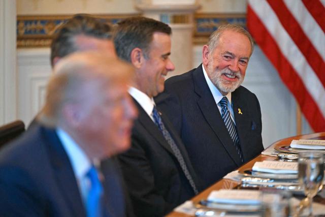 US Ambassador to Israel Mike Huckabee (R) smiles as US President Donald Trump (L) meets with unseen Israeli Prime Minister Benjamin Netanyahu at the Blue Room of the White House in Washington, DC, on July 7, 2025. Prime Minister Netanyahu will meet Monday with President Trump, who expressed hope for a "deal this week" between Israel and Hamas that sees hostages released from the Gaza Strip. Indirect negotiations between Israel and Hamas began on July 6 in Doha, aiming to broker a ceasefire and reach an agreement on the release of hostages in exchange for Palestinian prisoners. (Photo by ANDREW CABALLERO-REYNOLDS / AFP)