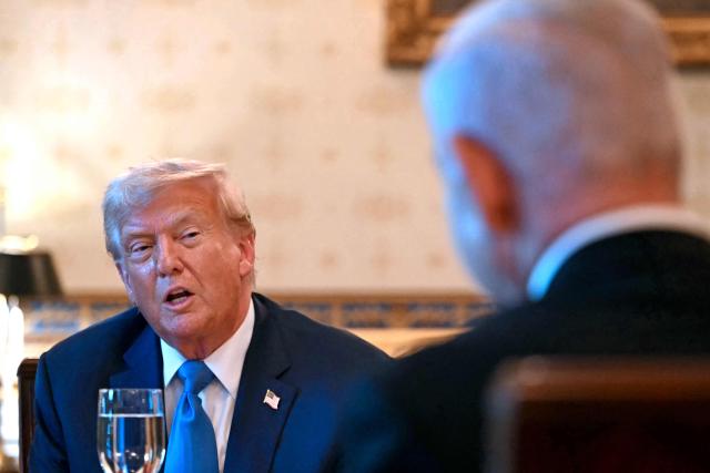 US President Donald Trump meets with Israeli Prime Minister Benjamin Netanyahu (R) at the Blue Room of the White House in Washington, DC, on July 7, 2025. Prime Minister Netanyahu will meet Monday with President Trump, who expressed hope for a "deal this week" between Israel and Hamas that sees hostages released from the Gaza Strip. Indirect negotiations between Israel and Hamas began on July 6 in Doha, aiming to broker a ceasefire and reach an agreement on the release of hostages in exchange for Palestinian prisoners. (Photo by ANDREW CABALLERO-REYNOLDS / AFP)