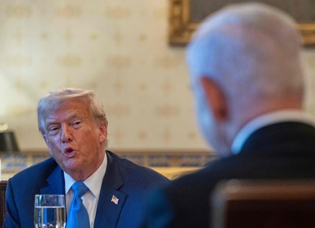 US President Donald Trump meets with Israeli Prime Minister Benjamin Netanyahu (R) at the Blue Room of the White House in Washington, DC, on July 7, 2025. Prime Minister Netanyahu will meet Monday with President Trump, who expressed hope for a "deal this week" between Israel and Hamas that sees hostages released from the Gaza Strip. Indirect negotiations between Israel and Hamas began on July 6 in Doha, aiming to broker a ceasefire and reach an agreement on the release of hostages in exchange for Palestinian prisoners. (Photo by ANDREW CABALLERO-REYNOLDS / AFP)