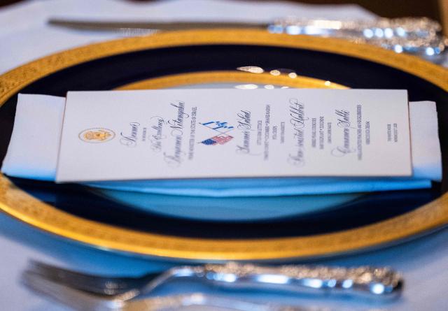 The official dinner invitation is seen as unseen US President Donald Trump meets with unseen Israeli Prime Minister Benjamin Netanyahu at the Blue Room of the White House in Washington, DC, on July 7, 2025. Prime Minister Netanyahu will meet Monday with President Trump, who expressed hope for a "deal this week" between Israel and Hamas that sees hostages released from the Gaza Strip. Indirect negotiations between Israel and Hamas began on July 6 in Doha, aiming to broker a ceasefire and reach an agreement on the release of hostages in exchange for Palestinian prisoners. (Photo by ANDREW CABALLERO-REYNOLDS / AFP)