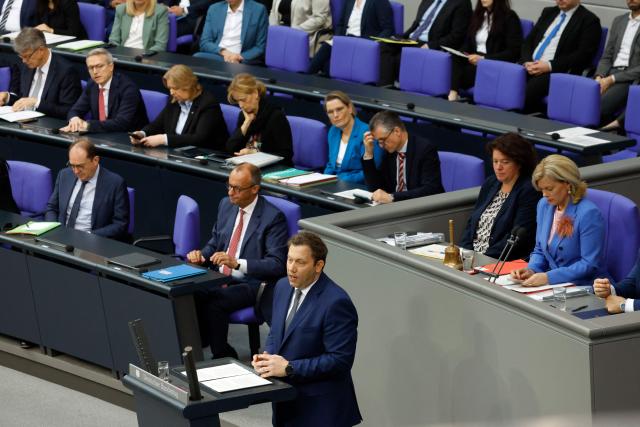 German Finance Minister and Vice Chancellor Lars Klingbeil (C) addresses delegates during a session on the government's 2025 budget draft on July 8, 2025 at the Bundestag (lower house of parliament) in Berlin. (Photo by Odd ANDERSEN / AFP)