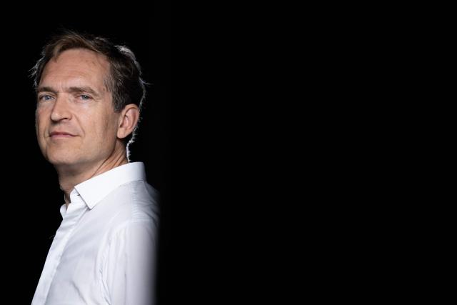 French author Fabrice Humbert poses during a photo session in Paris on July 7, 2025. (Photo by JULIEN DE ROSA / AFP)