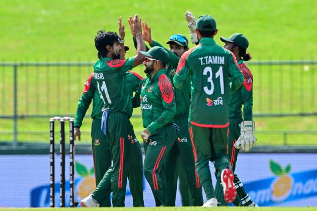 Bangladesh's Tanzim Hasan Sakib (L) celebrates with teammates after taking the wicket of Sri Lanka's Nishan Madushka during the third and final one-day international (ODI) cricket match between Sri Lanka and Bangladesh at the Pallekele International Cricket Stadium in Kandy on July 8, 2025. (Photo by Ishara S. KODIKARA / AFP)
