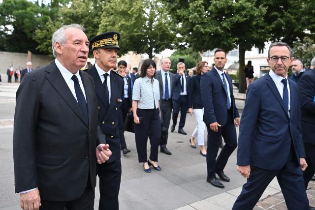 French Prime Minister Francois Bayrou (L) walks with France's Minister for the Interior, Bruno Retailleau (R) after a tribute to Jean Moulin and before presenting the reform of the State's territorial administration to regional and departmental prefects and to the secretaries-general of ministries, at the prefecture of Eure-et-Loir, in Chartres, central France, on July 8, 2025.  (Photo by JEAN-FRANCOIS MONIER / AFP)