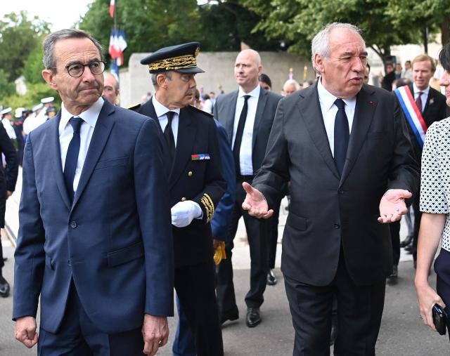 French Prime Minister Francois Bayrou (L) walks with France's Minister for the Interior, Bruno Retailleau (R) after a tribute to Jean Moulin and before presenting the reform of the State's territorial administration to regional and departmental prefects and to the secretaries-general of ministries, at the prefecture of Eure-et-Loir, in Chartres, central France, on July 8, 2025.  (Photo by JEAN-FRANCOIS MONIER / AFP)