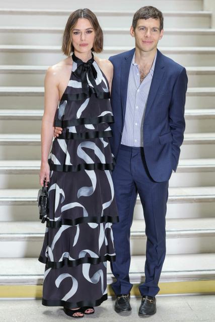 British actress Keira Knightley and her husband British musician James Righton pose upon arrival ahead of the Chanel's Haute-Couture Fall/Winter 2025-26 collection show in Paris on July 8, 2025. (Photo by Thomas SAMSON / AFP)