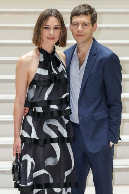 British actress Keira Knightley and her husband British musician James Righton pose upon arrival ahead of the Chanel's Haute-Couture Fall/Winter 2025-26 collection show in Paris on July 8, 2025. (Photo by Thomas SAMSON / AFP)