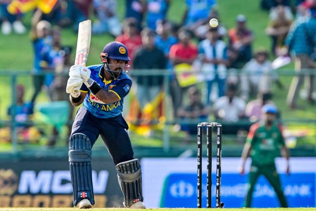 Sri Lanka's captain Charith Asalanka plays a shot during the third and final one-day international (ODI) cricket match between Sri Lanka and Bangladesh at the Pallekele International Cricket Stadium in Kandy on July 8, 2025. (Photo by Ishara S. KODIKARA / AFP)