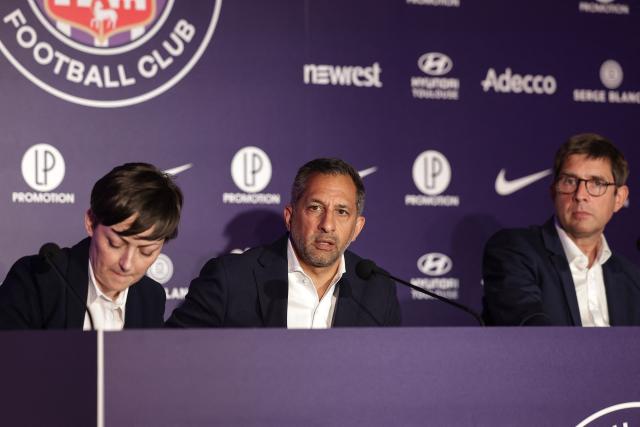 Managing Director of RedBird Capital Partners and Interim Chairman of TFC Neil Chugani (C), next to new Toulouse Football Club (TFC) President Olivier Cloarec (R), speaks during a press conference at the Stadium de Toulouse in Toulouse, southwestern France, on July 8, 2025. (Photo by Valentine CHAPUIS / AFP)