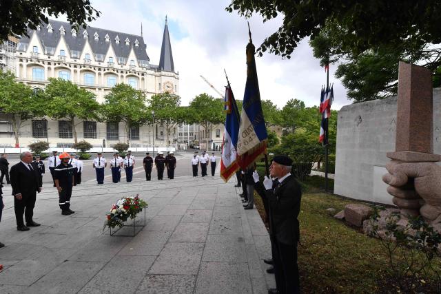 French Prime Minister Francois Bayrou (L) attends a tribute ceremony for French resistance member Jean Moulin at his memorial in Chartres, central France, on July 8, 2025. Bayrou makes a visit to present the reform of the State's territorial administration to regional and departmental prefects and to the secretaries-general of ministries. (Photo by JEAN-FRANCOIS MONIER / AFP)
