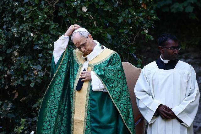 Pope Leo XIV (L) gestures as he leads the Mass for the Care of Creation in Castel Gandolfo, 40 km southeast of Rome on July 9, 2025. (Photo by Yara Nardi / POOL / AFP)