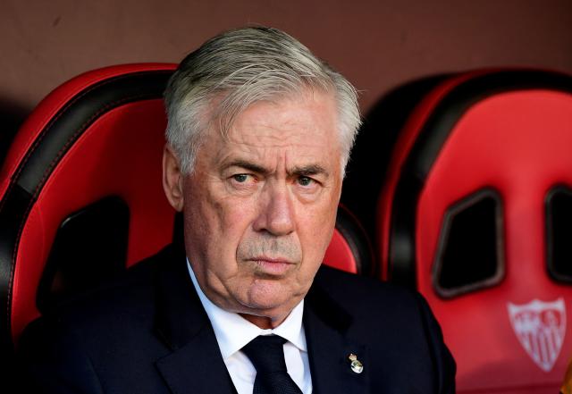 (FILES) Real Madrid's Italian coach Carlo Ancelotti is pictured before the Spanish league football match between Sevilla FC and Real Madrid CF at Ramon Sanchez Pizjuan Stadium in Seville on May 18, 2025. Real Madrid ex-coach Ancelotti gets year's jail for tax fraud in Spain according to court, AFP reports on July 9, 2025. (Photo by CRISTINA QUICLER / AFP)