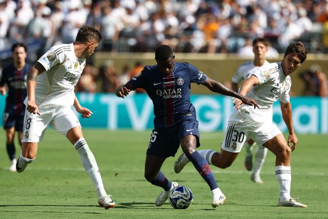 Real Madrid's Uruguayan midfielder #08 Federico Valverde and Spanish forward #30 Gonzalo Garciafight for the ball with Paris Saint-Germain's Portuguese defender #25 Nuno Mendes during the FIFA Club World Cup 2025 semifinal football match between France's Paris Saint-Germain and Spain's Real Madrid at the MetLife stadium in East Rutherford, New Jersey on July 9, 2025. (Photo by FRANCK FIFE / AFP)