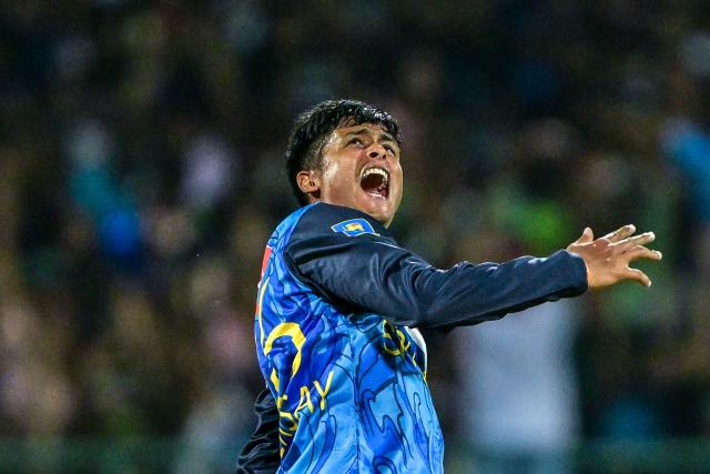 Sri Lanka's Jeffrey Vandersay celebrates after taking the wicket of Bangladesh's captain Litton Das during the first Twenty20 international cricket match between Sri Lanka and Bangladesh at the Pallekele International Cricket Stadium in Kandy on July 10, 2025. (Photo by Ishara S. KODIKARA / AFP)