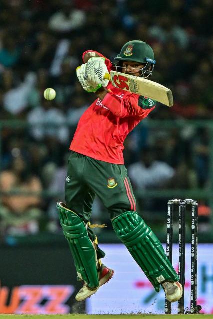 Bangladesh's Towhid Hridoy plays a shot during the first Twenty20 international cricket match between Sri Lanka and Bangladesh at the Pallekele International Cricket Stadium in Kandy on July 10, 2025. (Photo by Ishara S. KODIKARA / AFP)