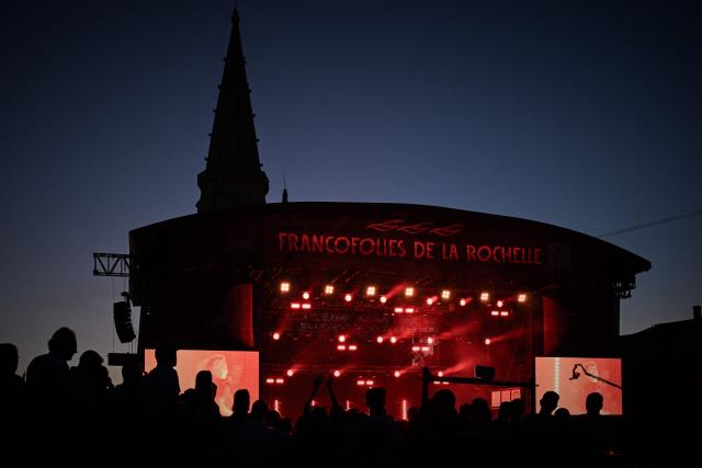 Festivalgoers attend the first day of the 41st edition of Francofolies de la Rochelle music festival in La Rochelle, southwestern France on July 10, 2025. (Photo by Philippe LOPEZ / AFP)