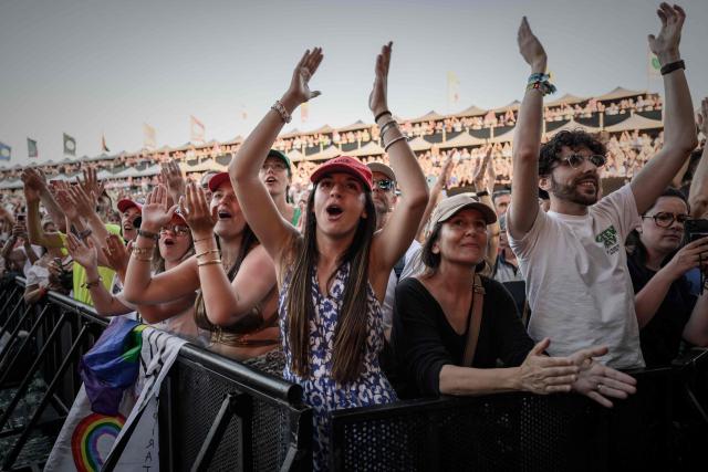 Festivalgoers attend the first day of the 41st edition of Francofolies de la Rochelle music festival in La Rochelle, southwestern France on July 10, 2025. (Photo by Philippe LOPEZ / AFP)