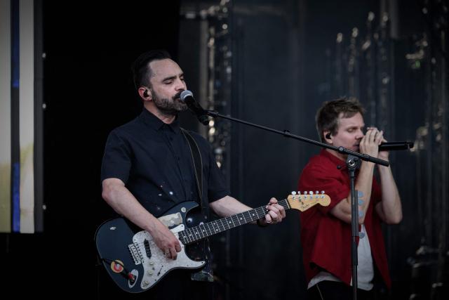 Lead guitarist of the Kyo French rock band Nicolas Chassagne and lead singer Benoit Poher during the first day of the 41st edition of Francofolies de la Rochelle music festival in La Rochelle, southwestern France on July 10, 2025. (Photo by Philippe LOPEZ / AFP)